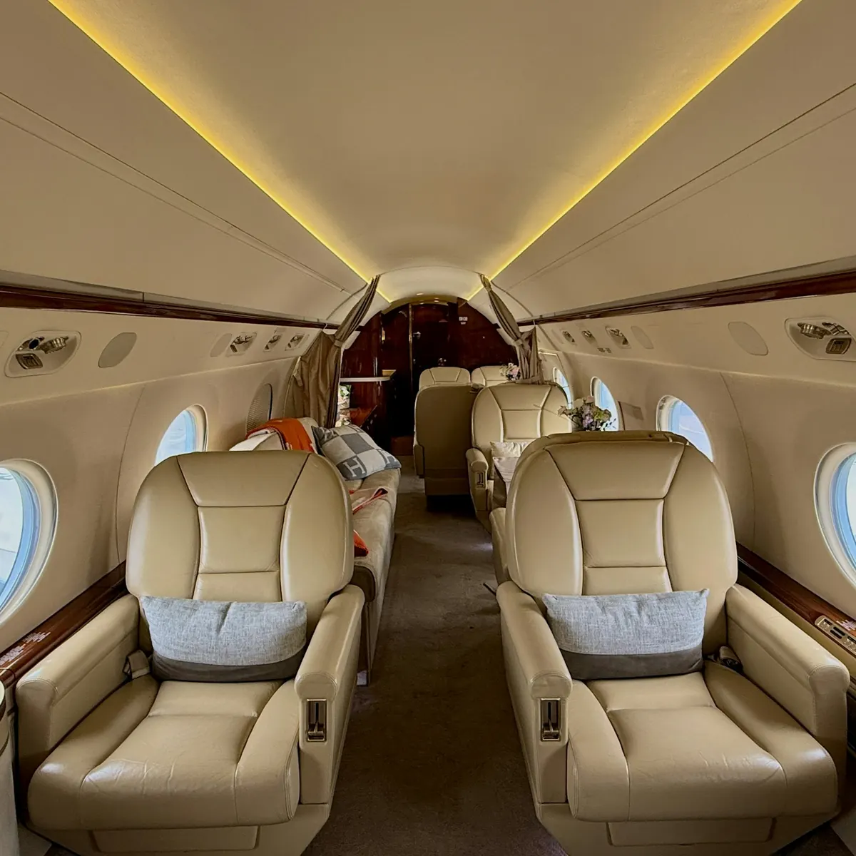 Warmly lit cabin with leather club seats