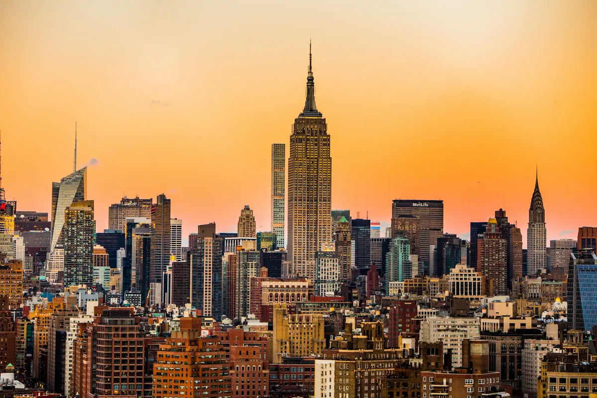Midtown Manhattan towers glowing at sunset