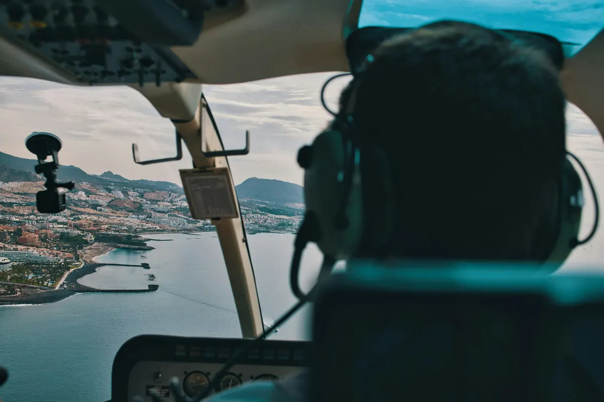Coastline seen from a helicopter cockpit