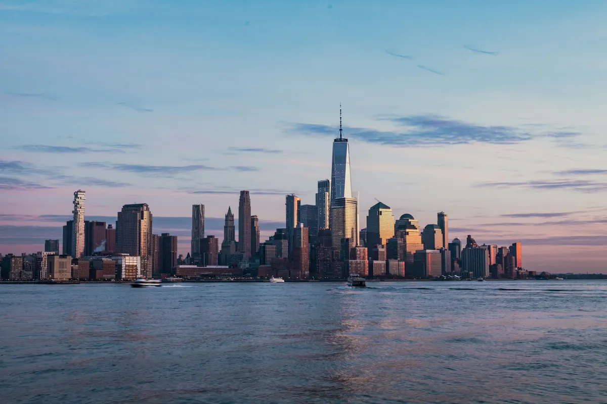 Manhattan skyline across the Hudson at dusk