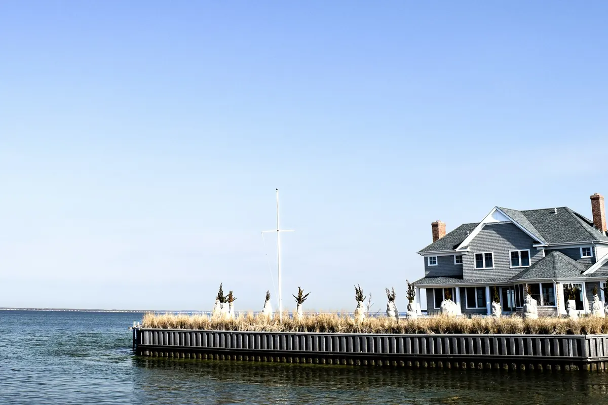Waterfront house at the end of a wooden pier