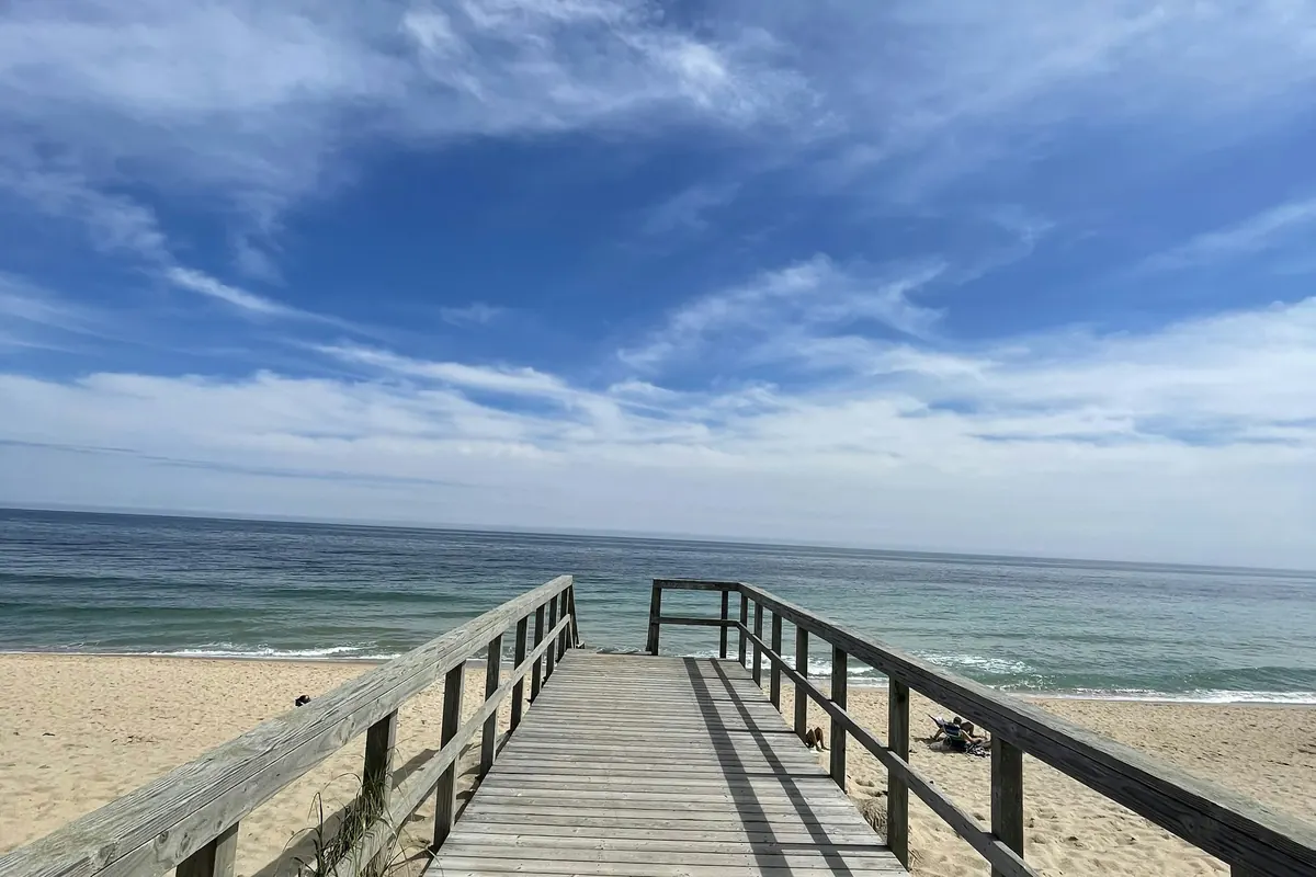Wooden boardwalk leading over the dunes to the beach